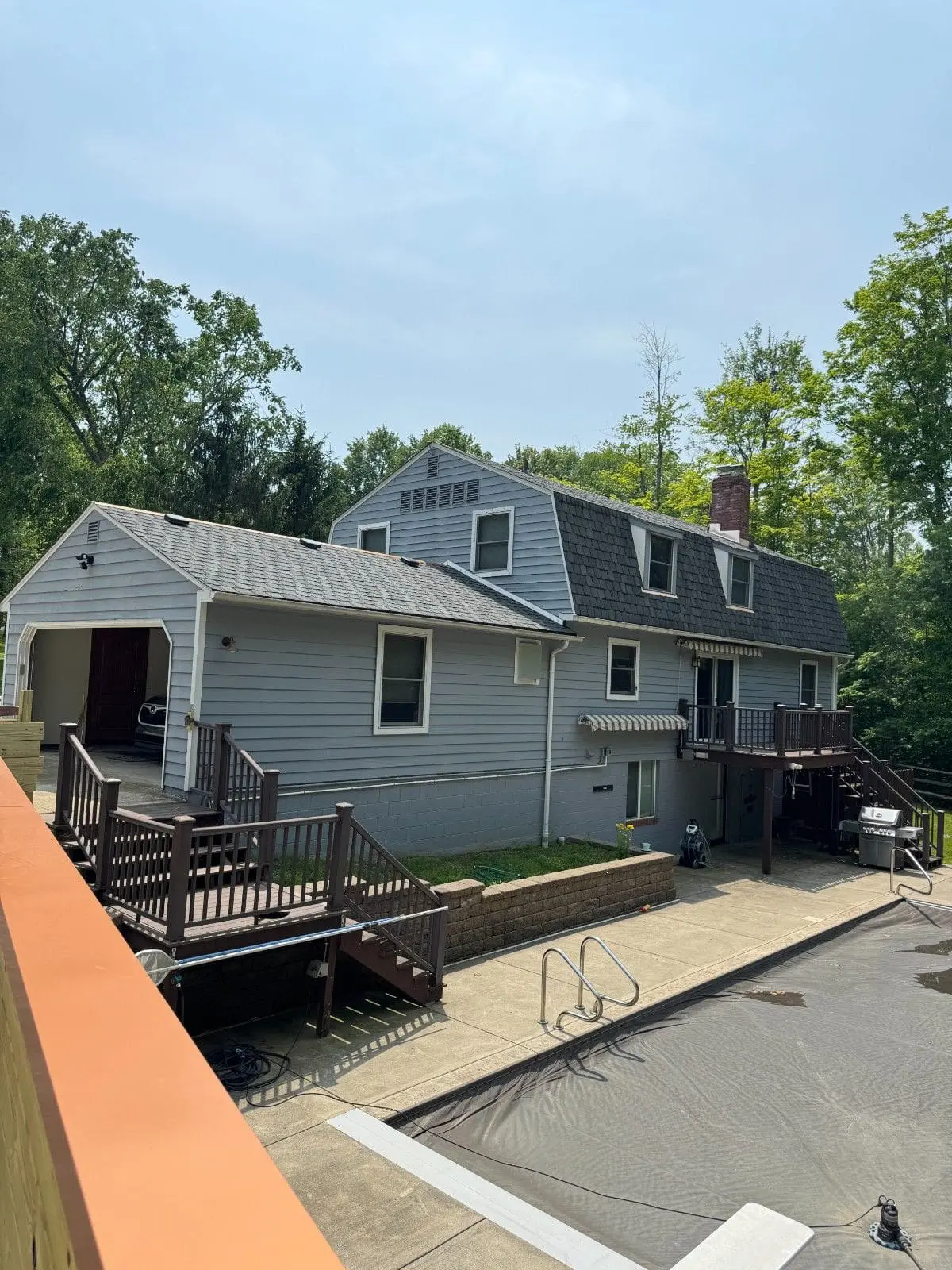 True North Painting exterior painting gallery light gray house with garage Chesterland Ohio